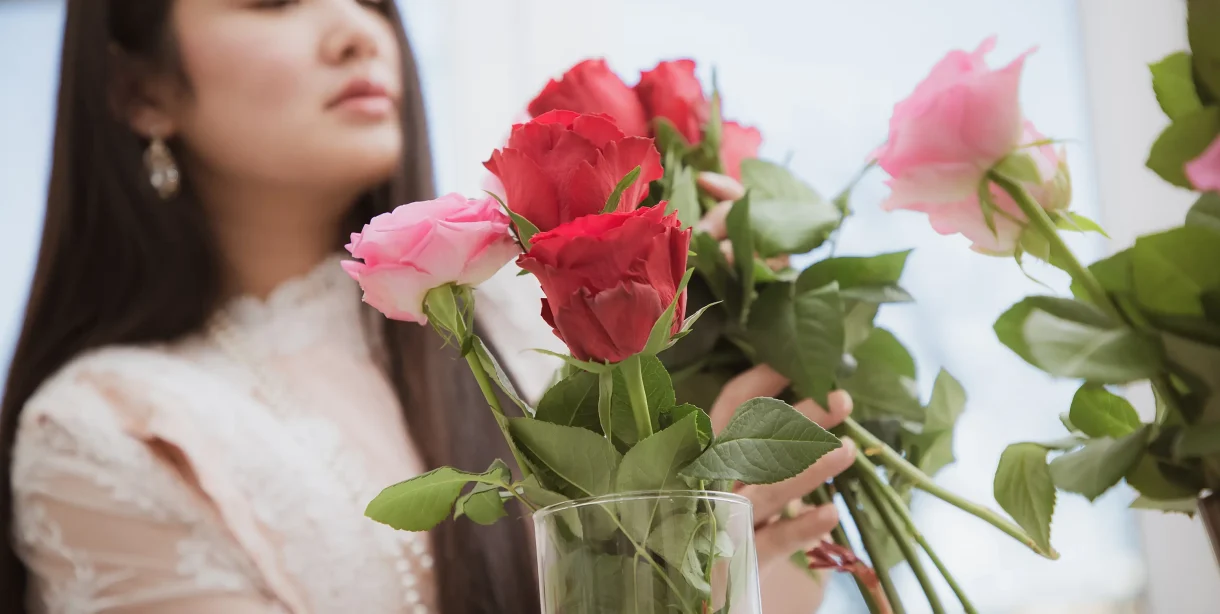 Woman preparing flower arrangement for a downtown Hot Springs loft rental