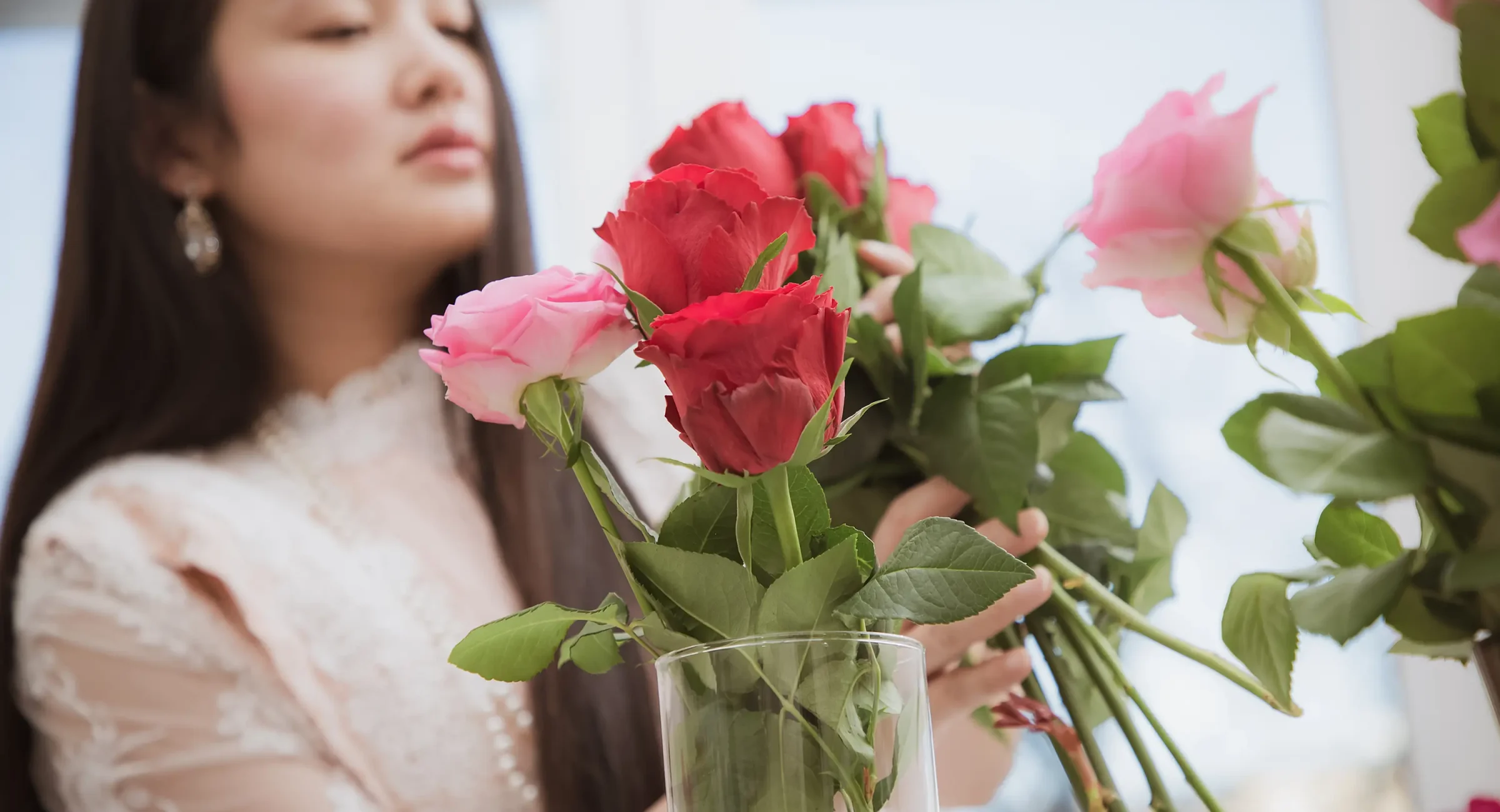 Woman preparing flower arrangement for a downtown Hot Springs loft rental