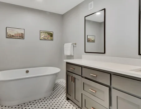 Soaking tub and double-sink vanity inside a downtown Arkansas boutique hotel