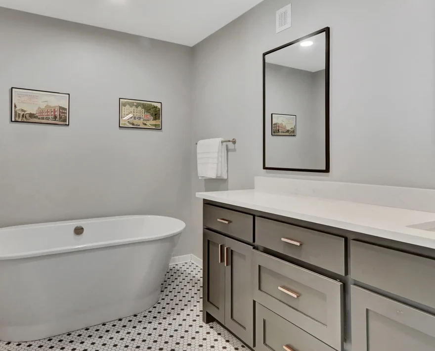 Soaking tub and double-sink vanity inside a downtown Arkansas boutique hotel