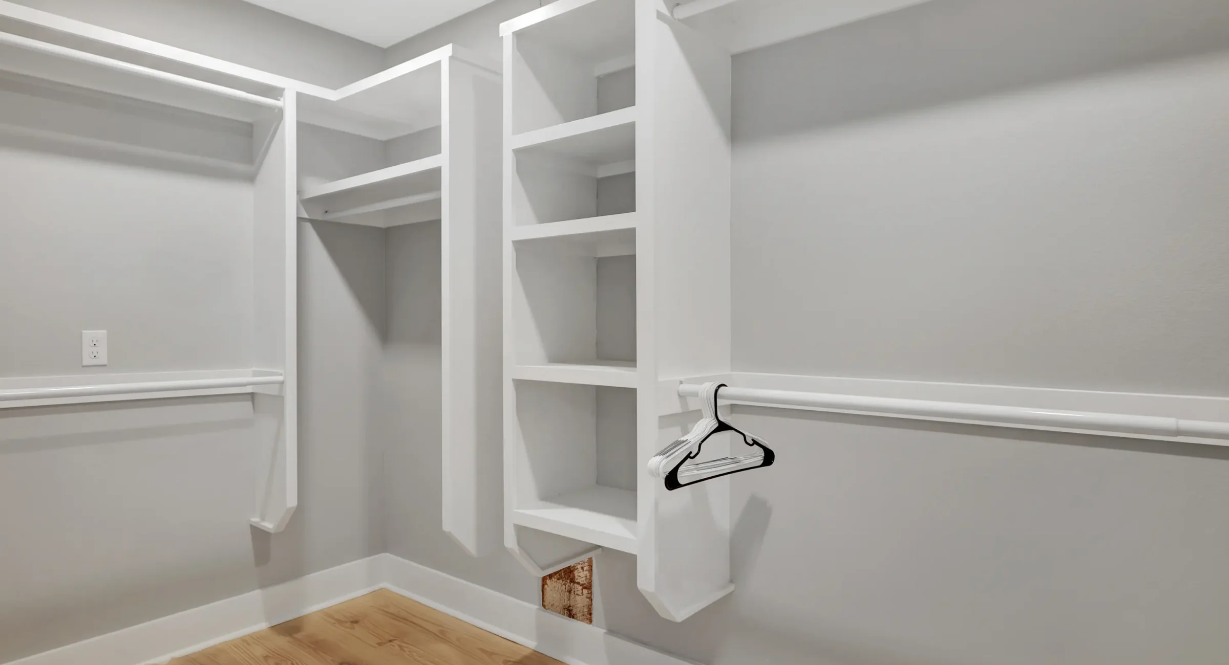 Large walk-in closet with built-in shelving at Arkansas vacation rentals downtown