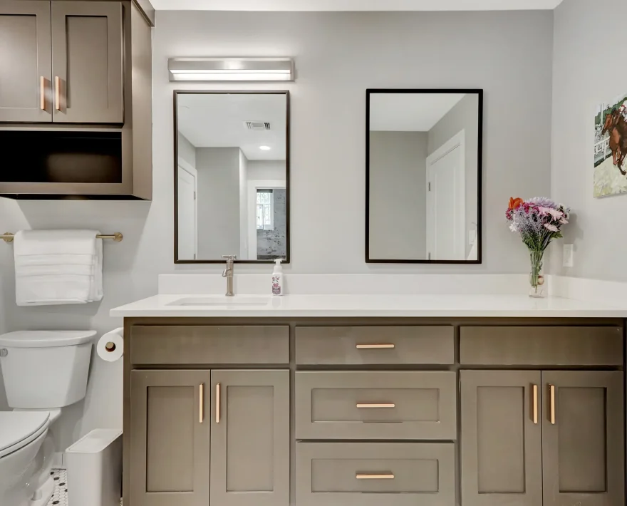 Modern bathroom in a downtown Hot Springs loft accommodation featuring a wide vanity, double mirrors, and contemporary finishes