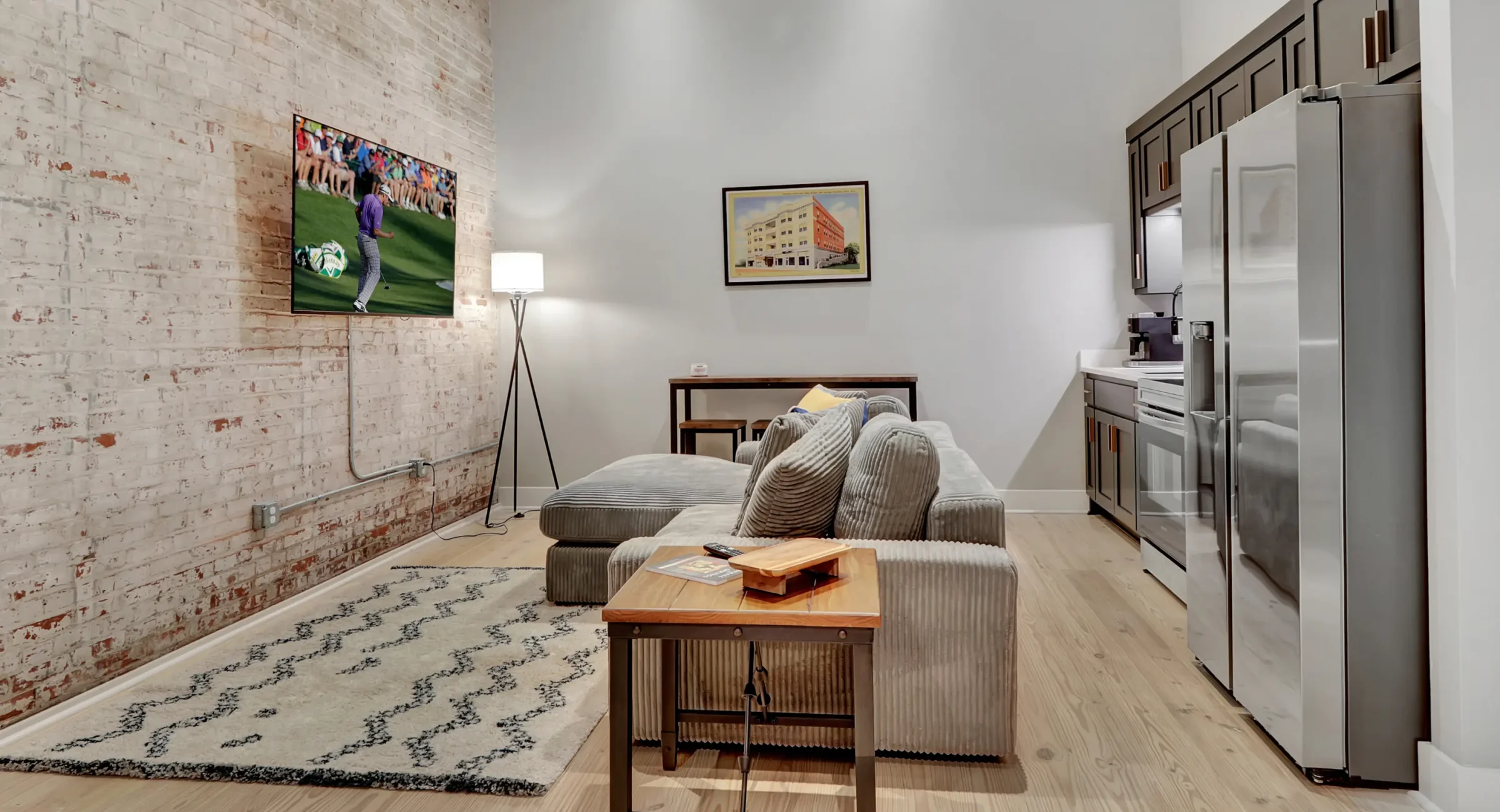 Open-concept living space in a Hot Springs AR vacation rental with exposed brick