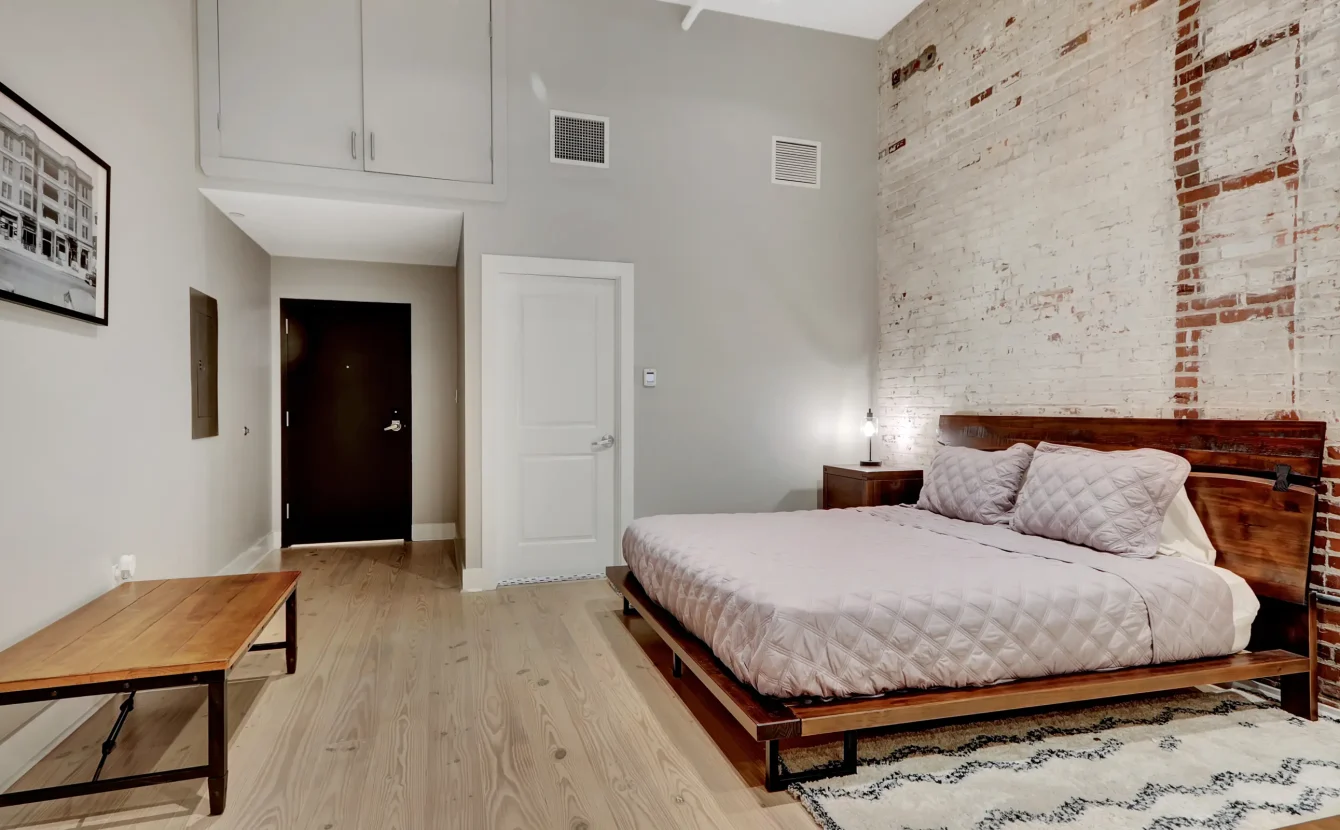 King bedroom in historic loft-style downtown Hot Springs accommodations