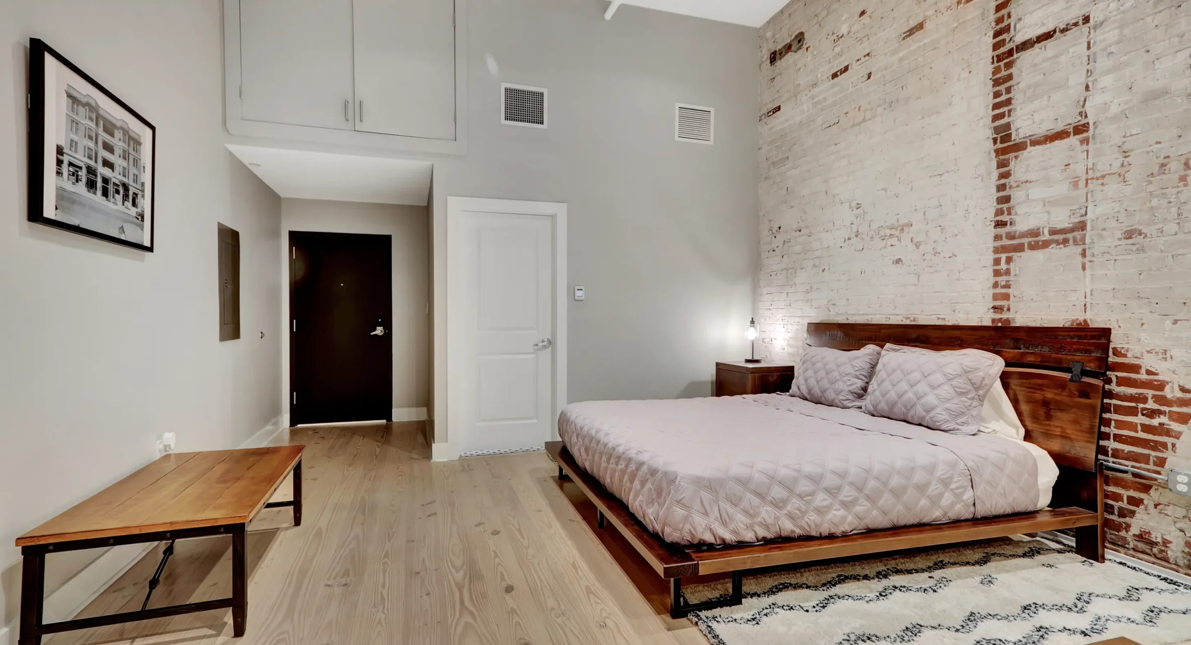 King bedroom in historic loft-style downtown Hot Springs accommodations