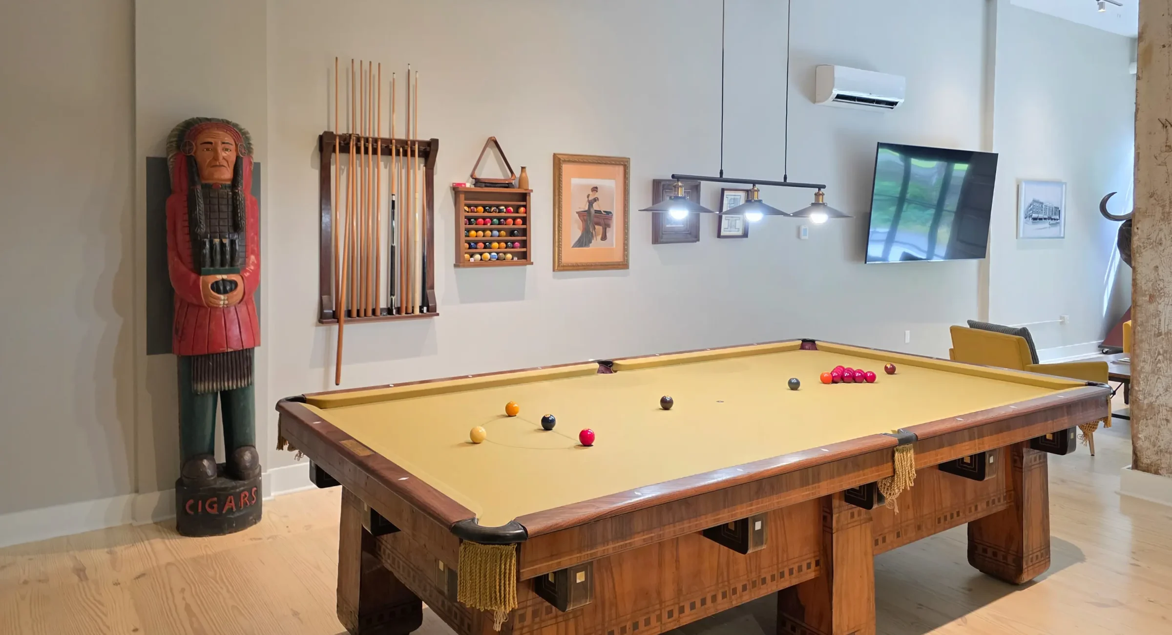 Open game area with a classic pool table inside a downtown Hot Springs lodging