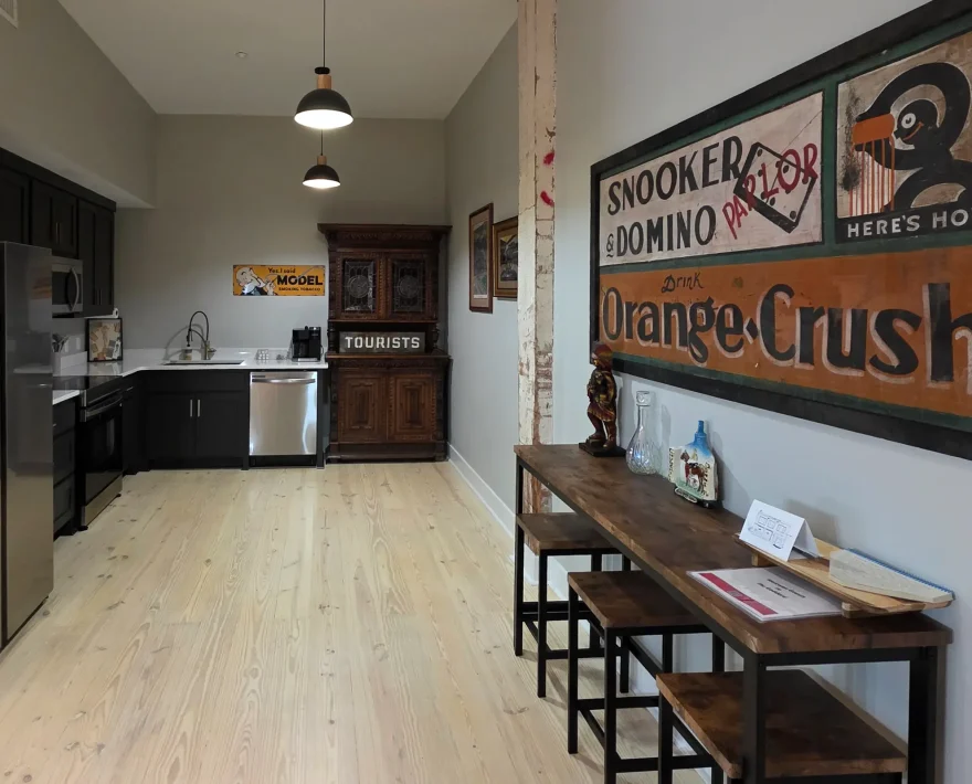 Full modern kitchen with stainless appliances and dark cabinetry inside a downtown Hot Springs accommodation