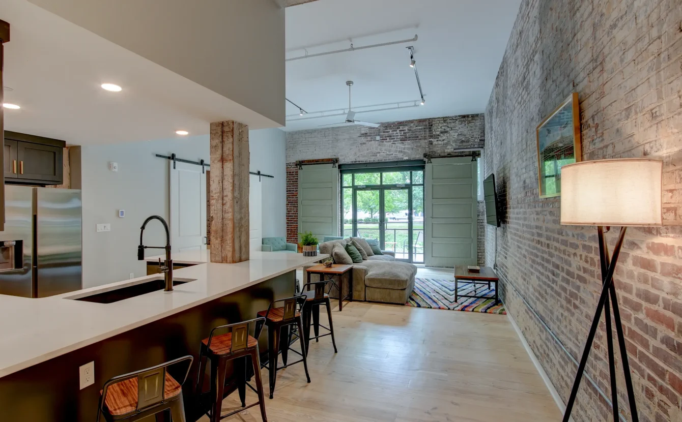 Accommodations with exposed brick and open living space near Bathhouse Row