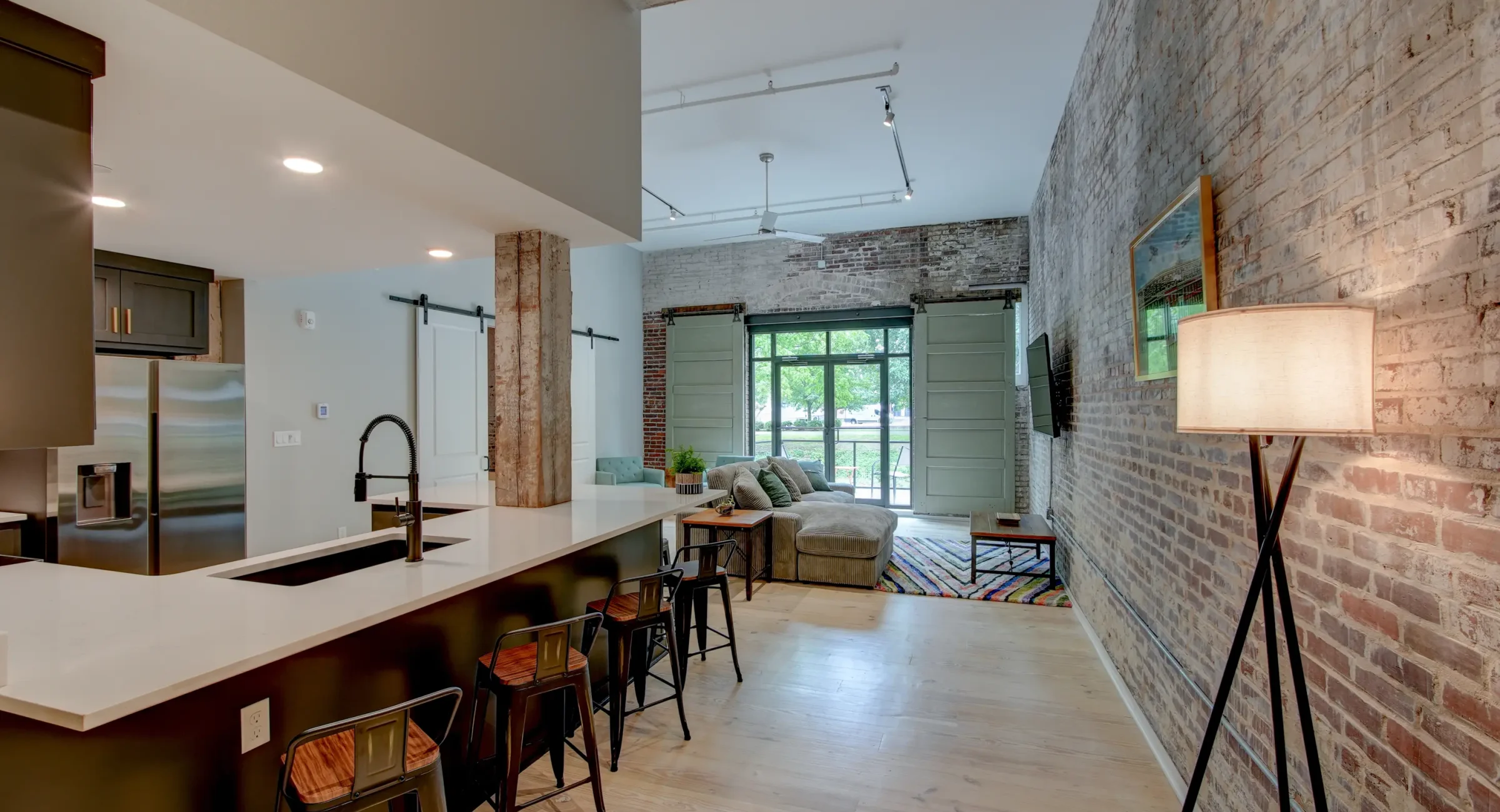 Accommodations with exposed brick and open living space near Bathhouse Row