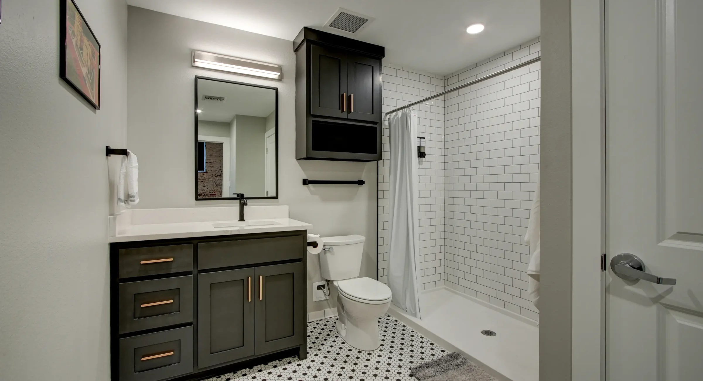 Updated bathroom with walk-in subway tile shower in Hot Springs rental