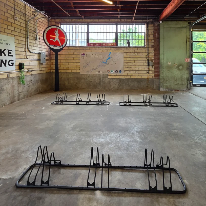 Bike parking area inside a renovated Hot Springs accommodation with dedicated storage for cyclists