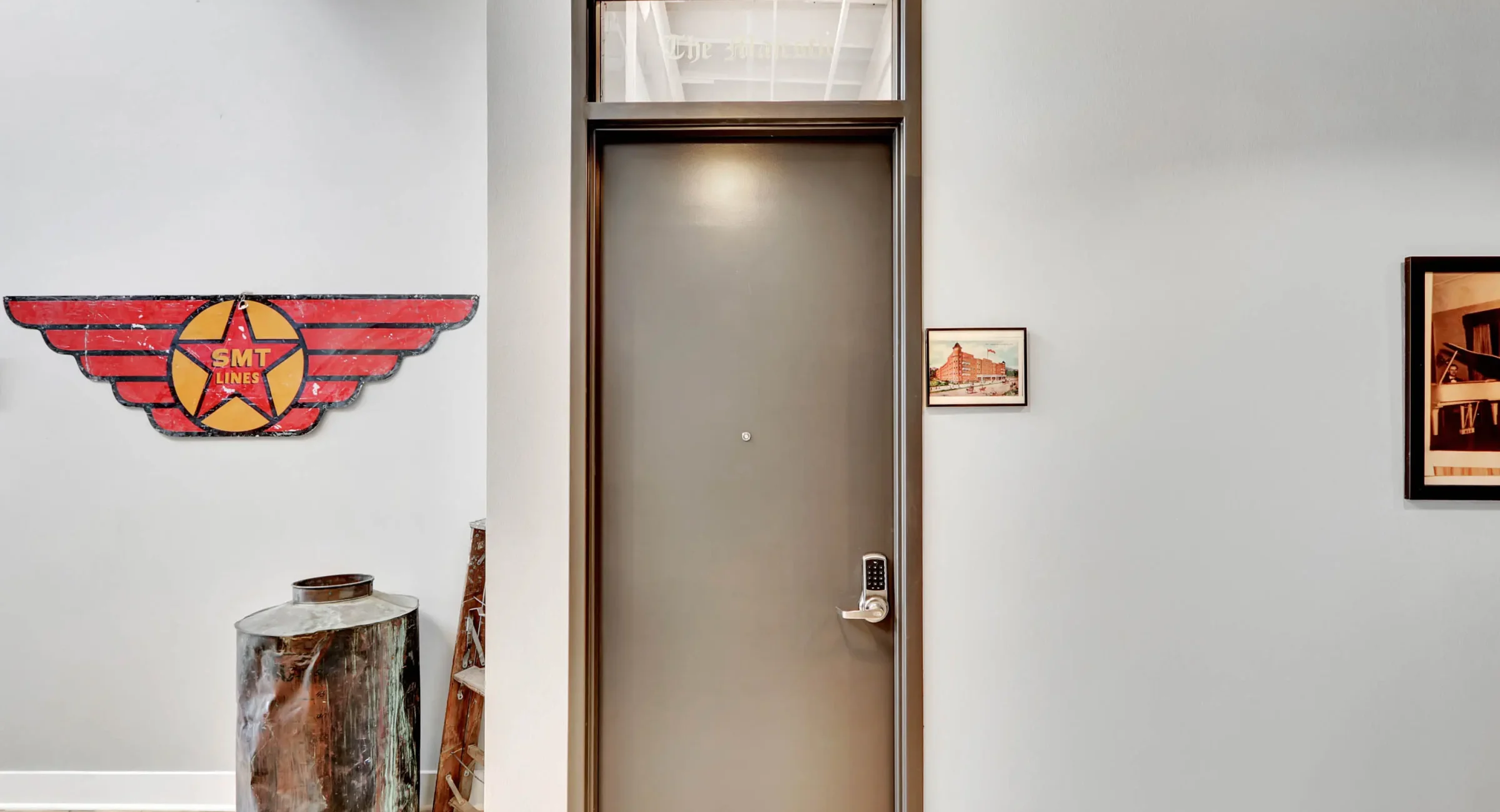 Industrial-style entry with historic SMT Lines wall art in downtown Hot Springs
