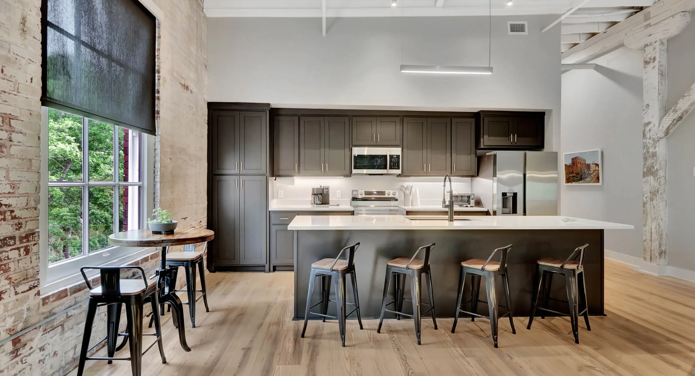 Modern kitchen with island seating inside a historic downtown Hot Springs building