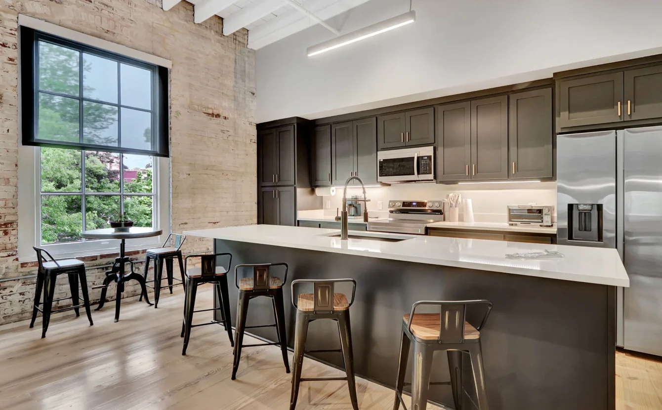 Modern kitchen with island seating inside a historic downtown Hot Springs building