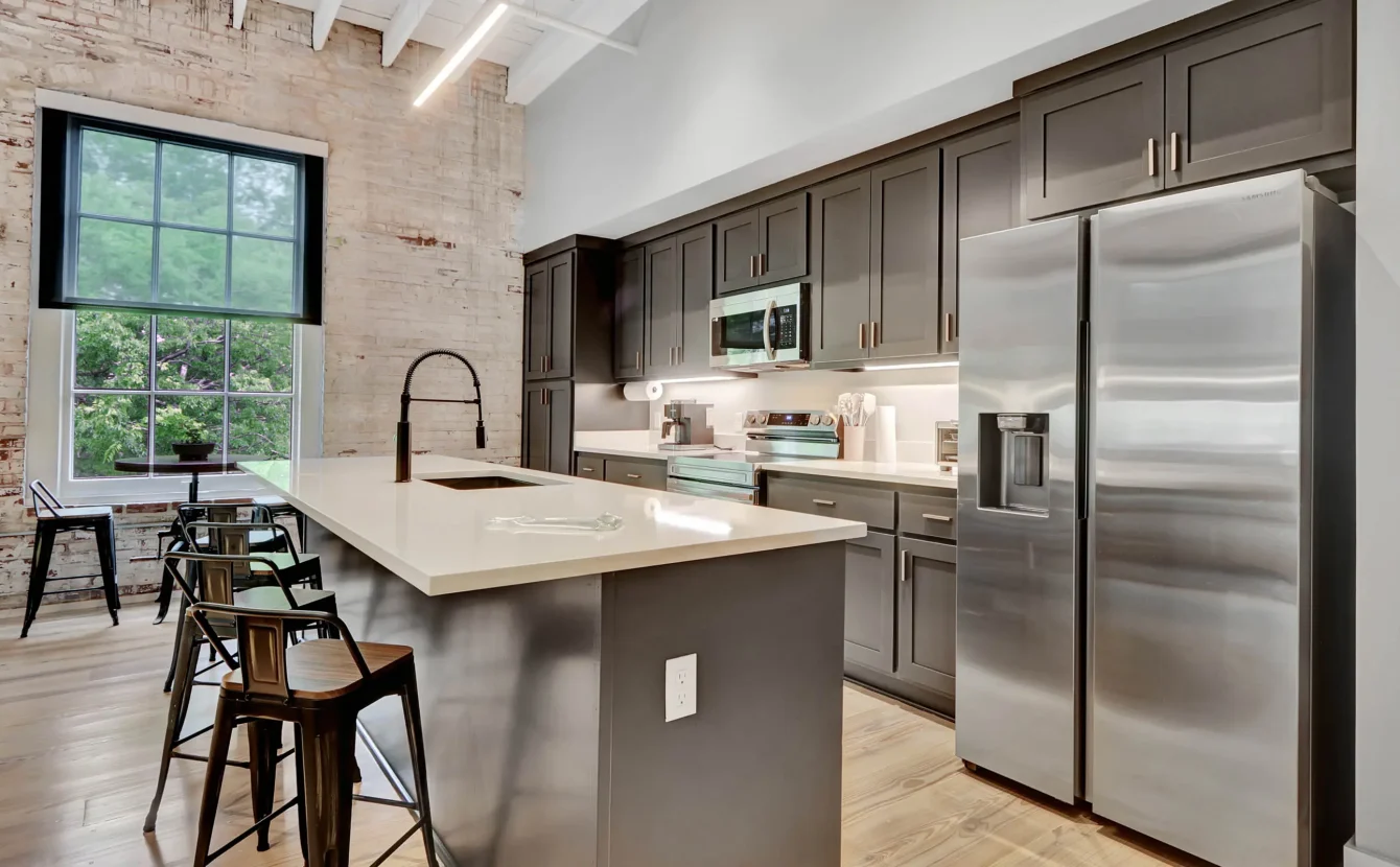 Downtown Hot Springs loft kitchen blending modern finishes with historic structure