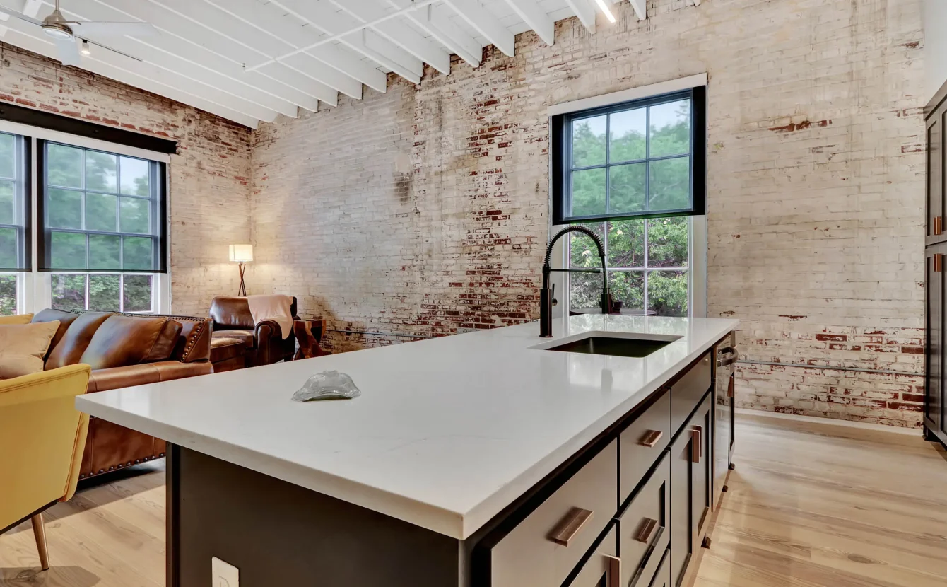 Open-concept living area with modern kitchen island in downtown Hot Springs lodging