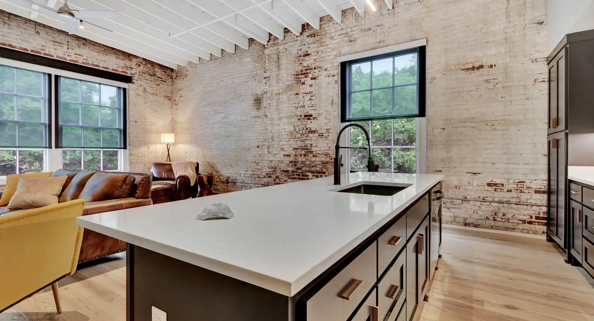 Open-concept living area with modern kitchen island in downtown Hot Springs lodging