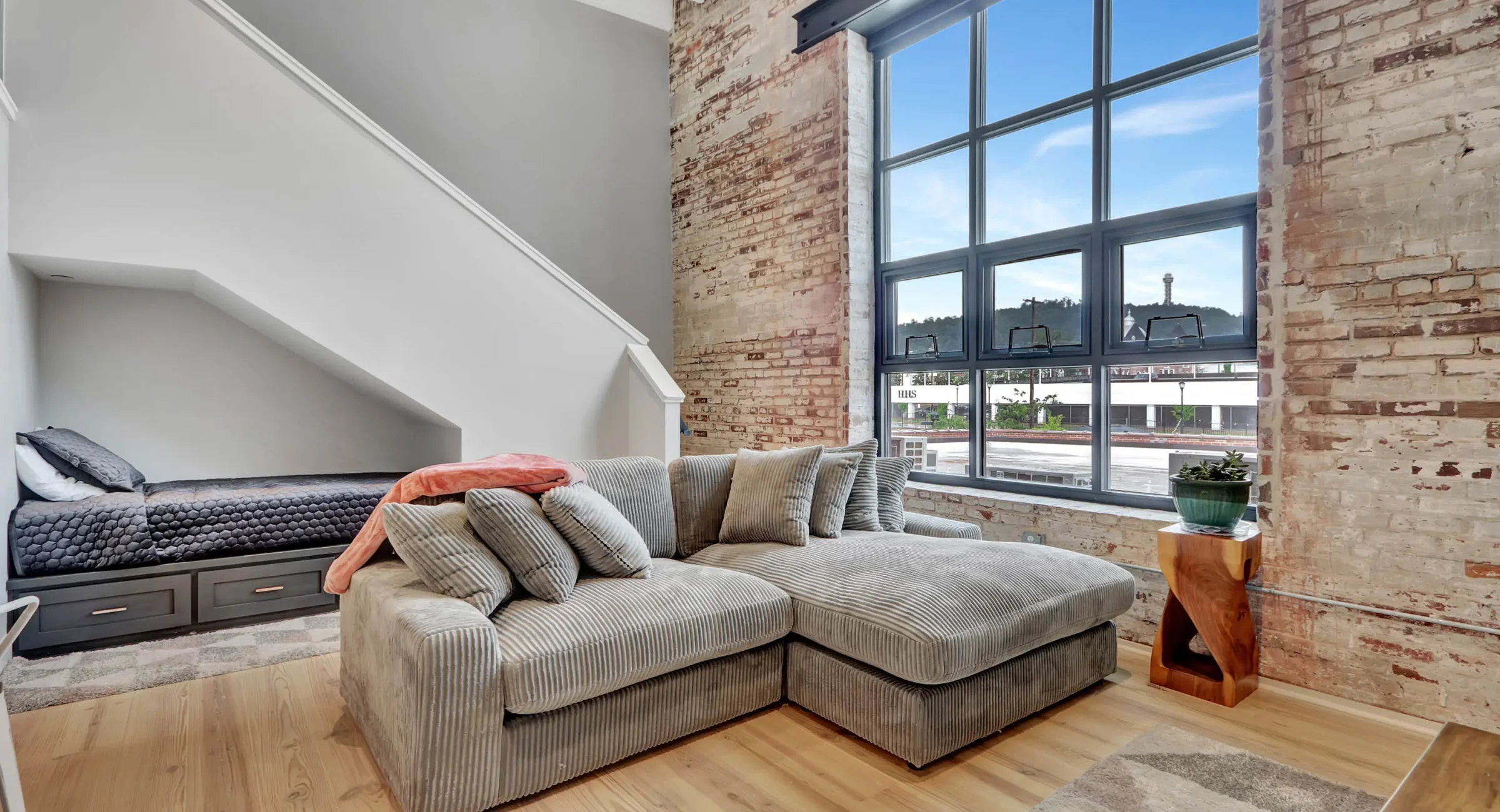 Loft living area with large industrial windows in downtown Hot Springs