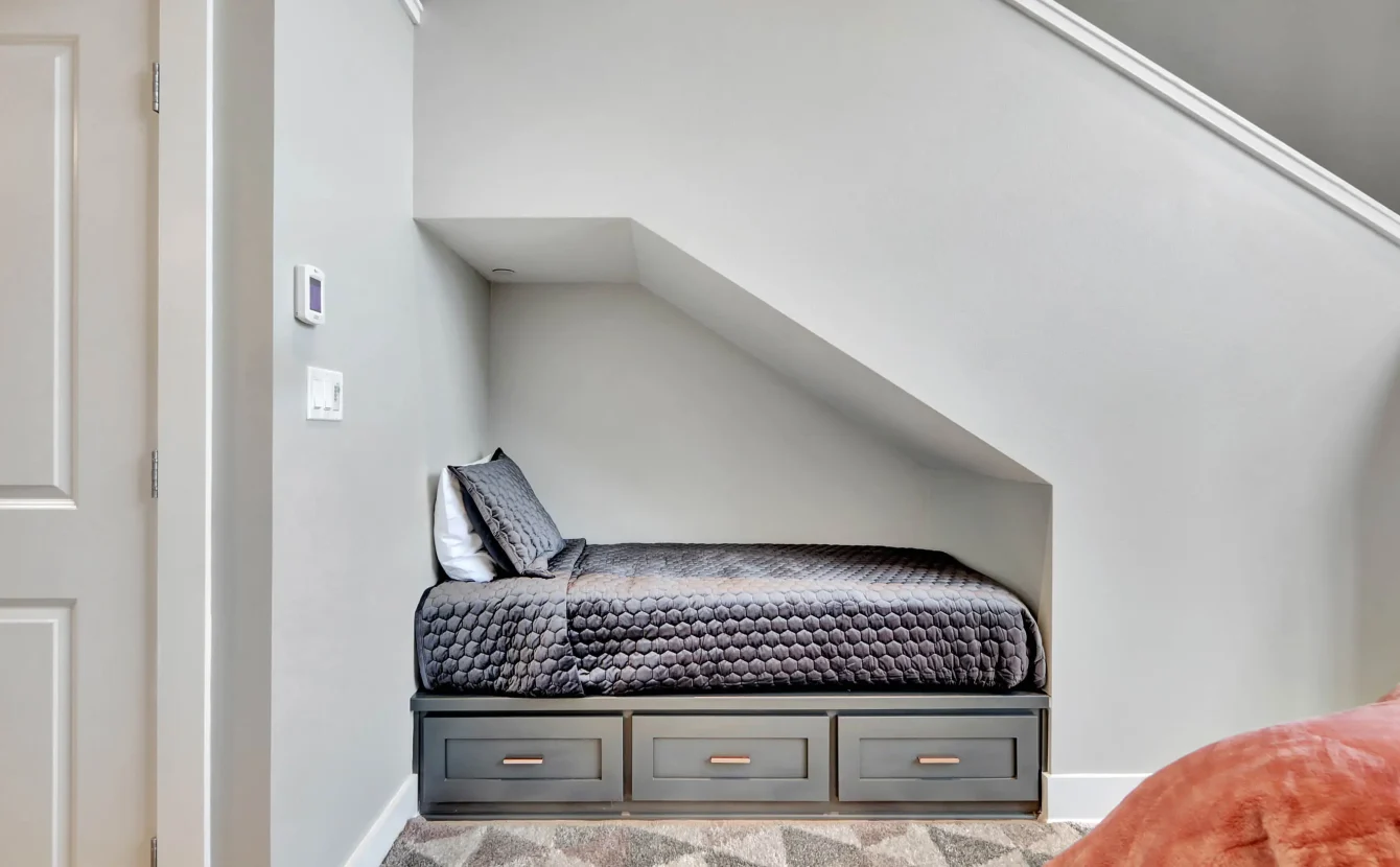 Built-in bed beneath staircase in downtown Hot Springs loft