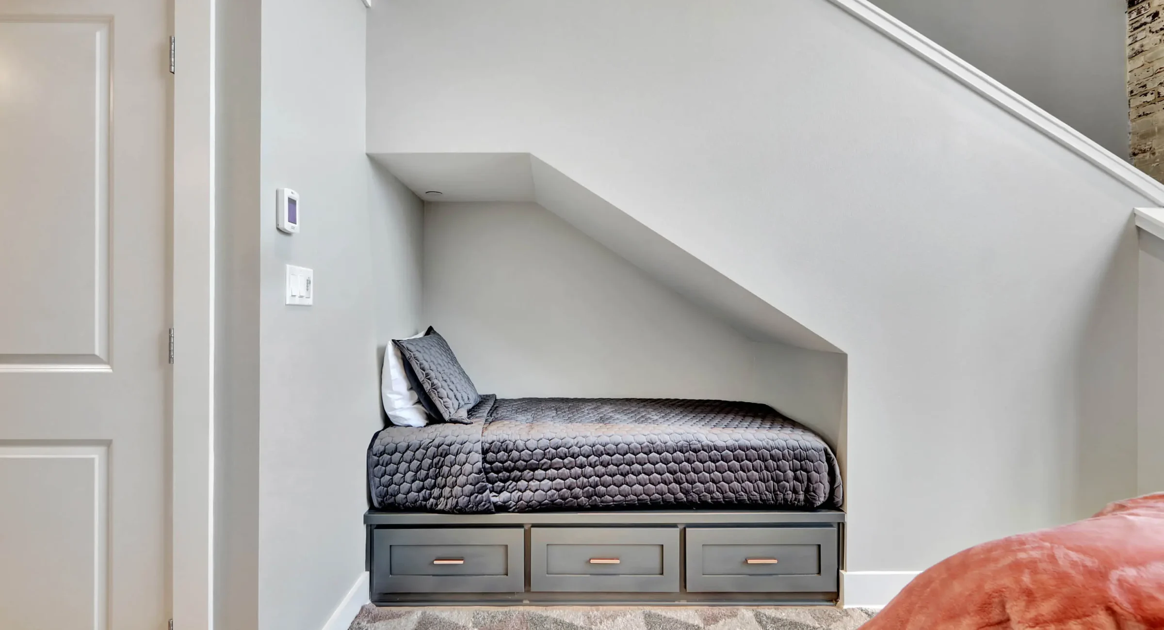 Built-in bed beneath staircase in downtown Hot Springs loft