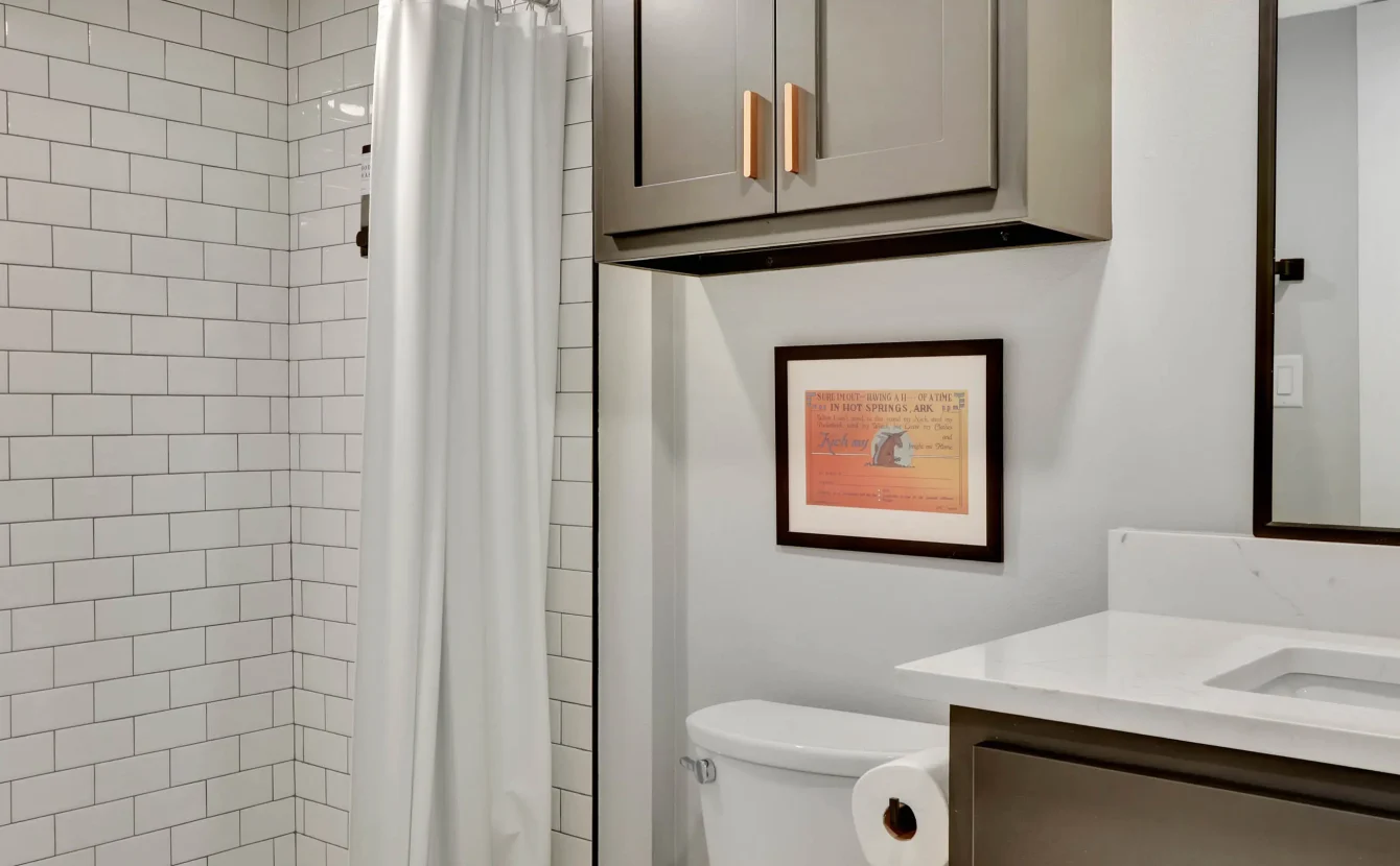 Bathroom vanity and walk-in shower in downtown Hot Springs lodging