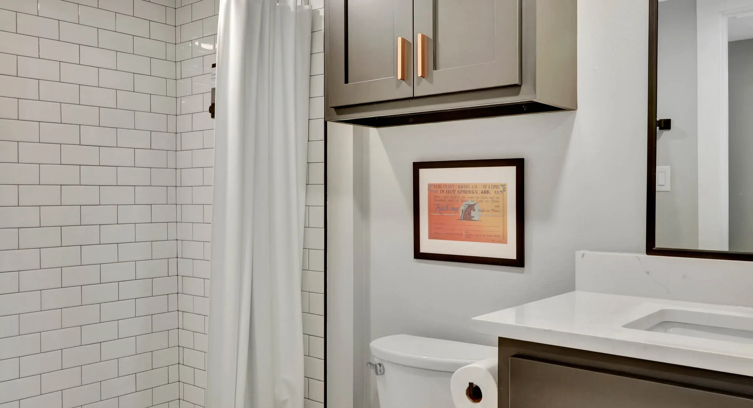 Bathroom vanity and walk-in shower in downtown Hot Springs lodging