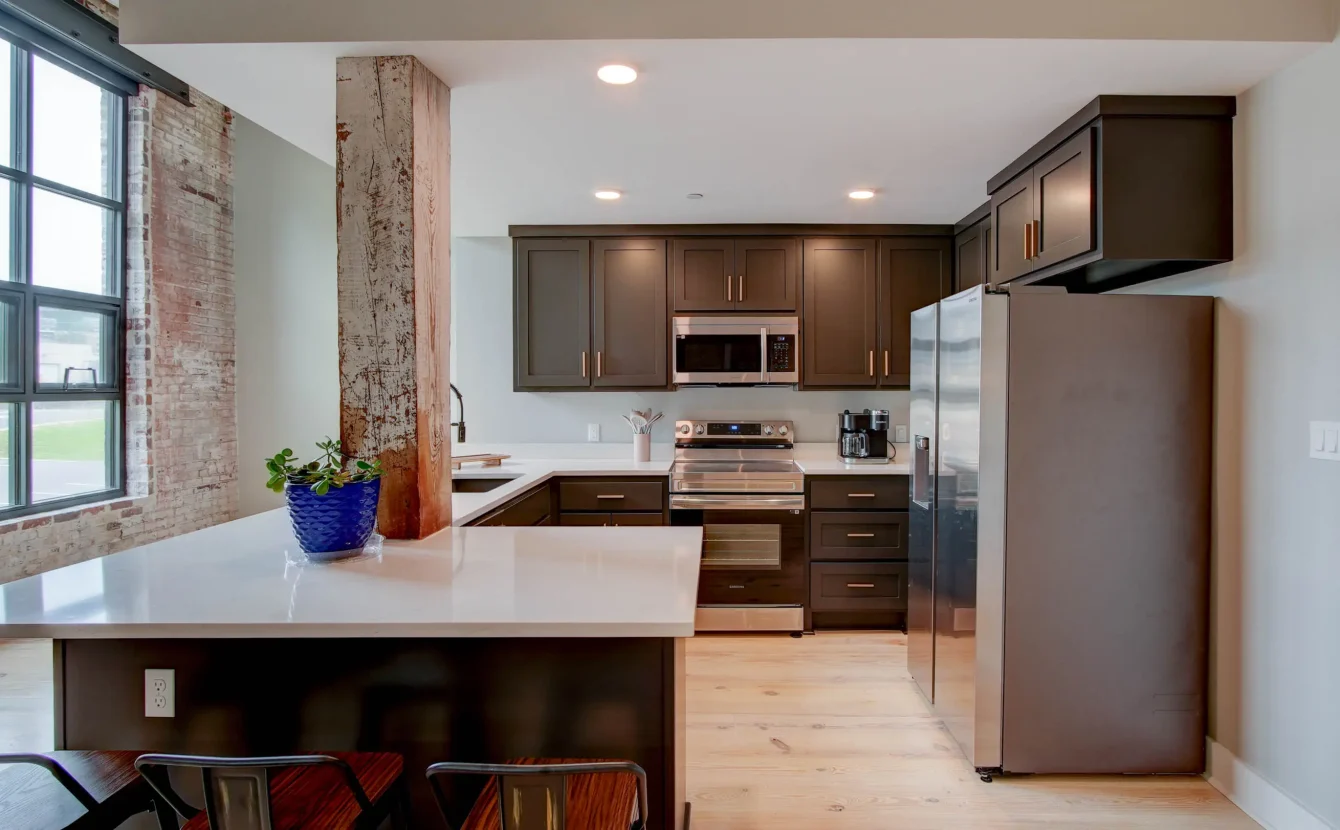 Fully equipped kitchen in historic loft at Lofts at Creek Street