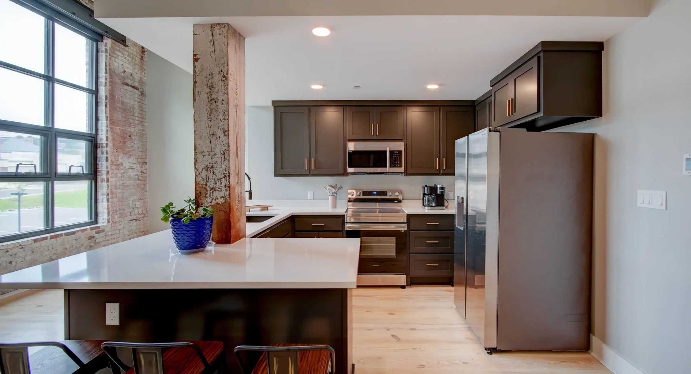 Fully equipped kitchen in historic loft at Lofts at Creek Street