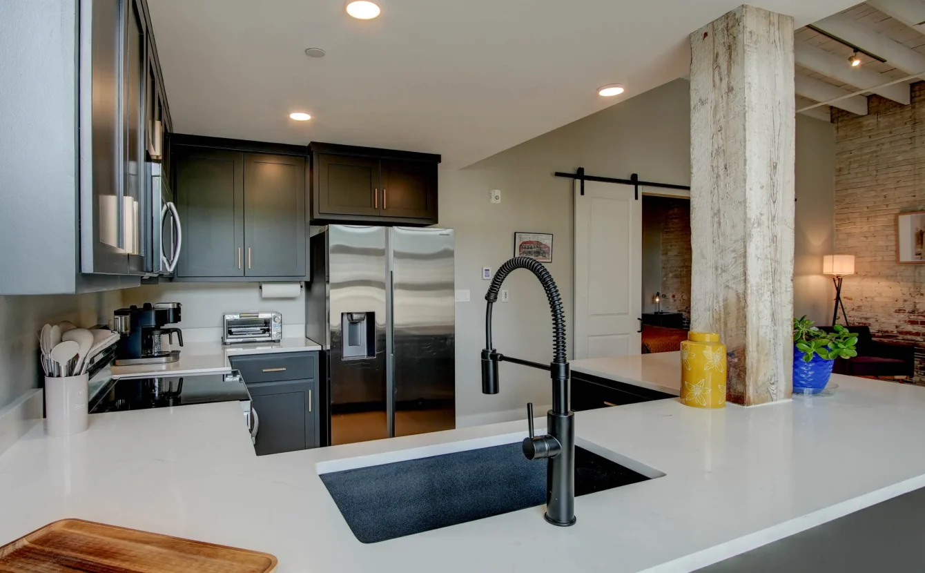 Modern kitchen sink and fixtures in downtown Hot Springs loft