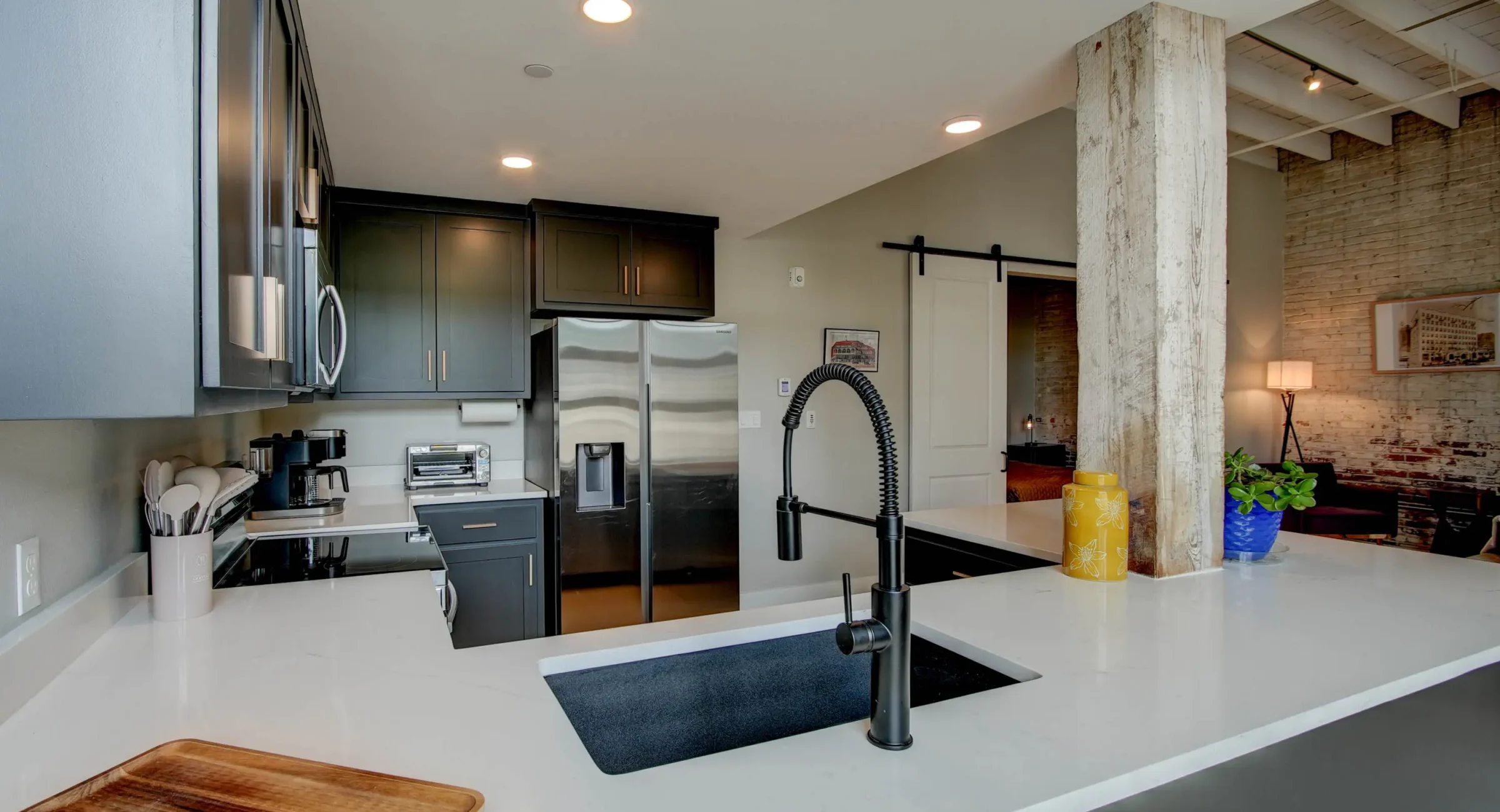Modern kitchen sink and fixtures in downtown Hot Springs loft