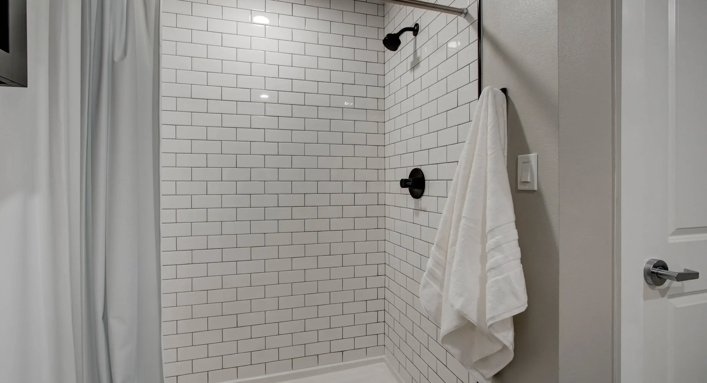Walk-in shower bathroom with subway tile in Hot Springs loft rental