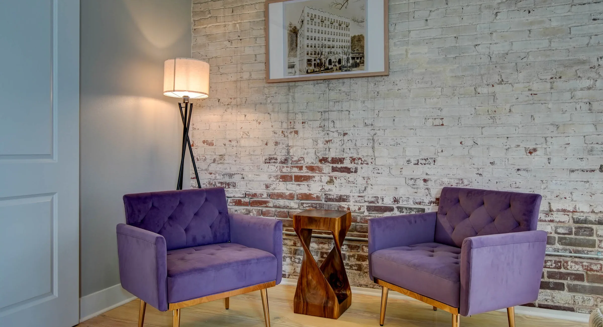 Lounge seating area with brick walls in downtown Hot Springs lodging