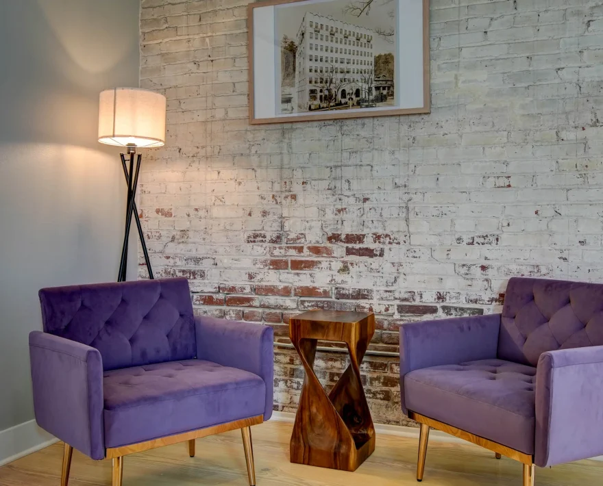 Lounge seating area with brick walls in downtown Hot Springs lodging