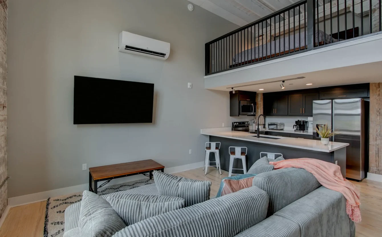 Loft living room with kitchen view in downtown Hot Springs vacation rental