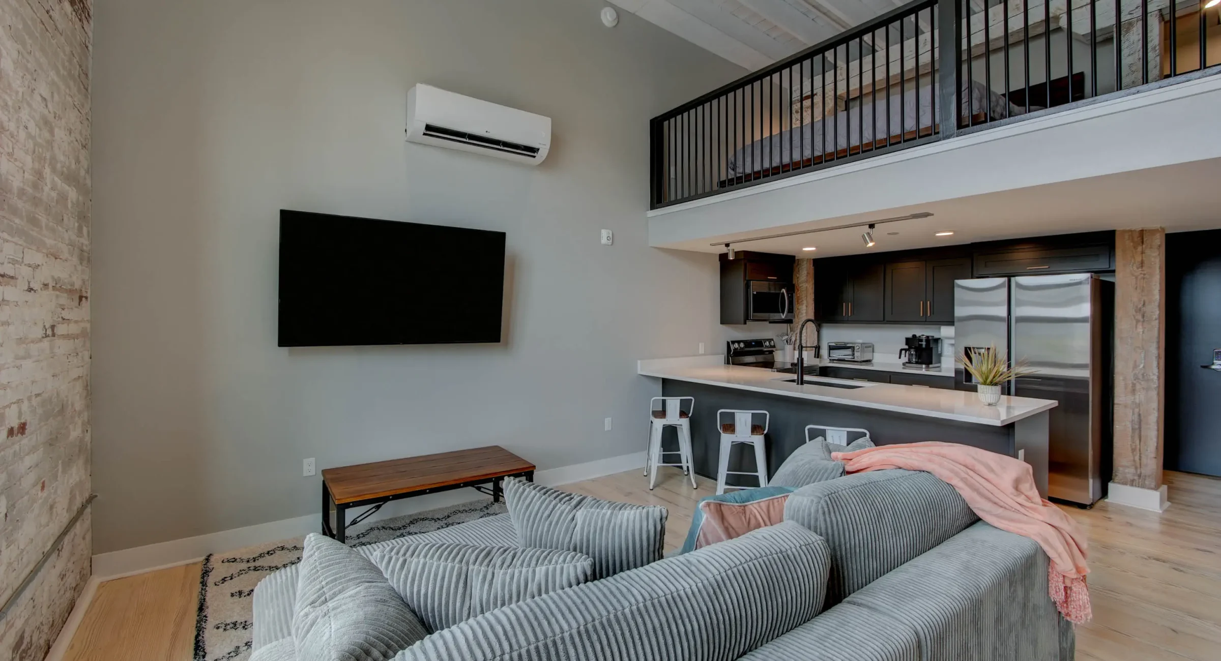 Loft living room with kitchen view in downtown Hot Springs vacation rental