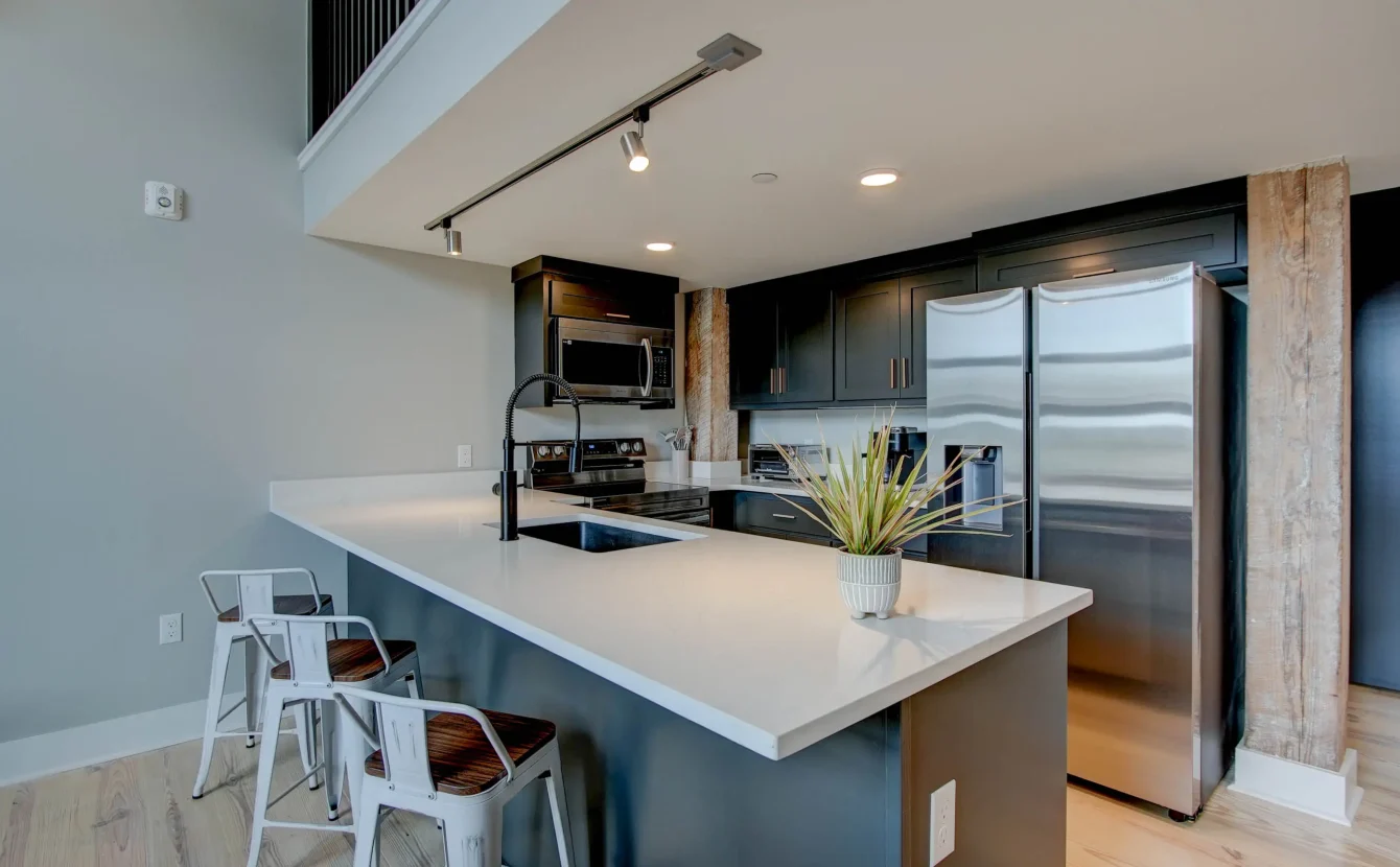 Kitchen island and open shelving in historic Hot Springs loft