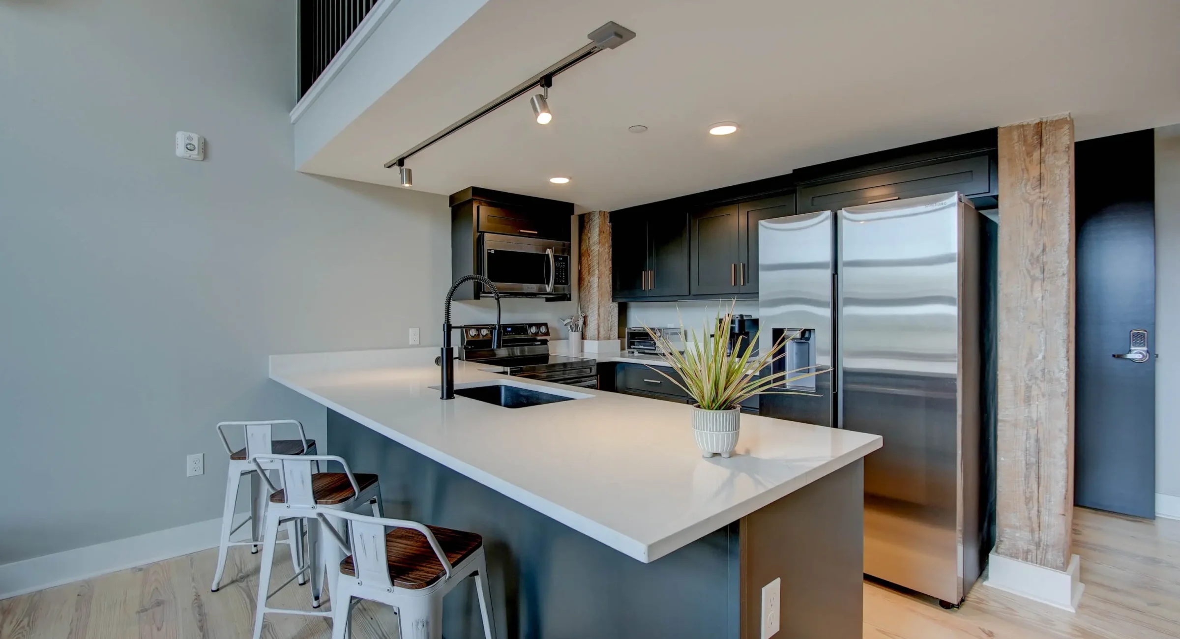 Kitchen island and open shelving in historic Hot Springs loft