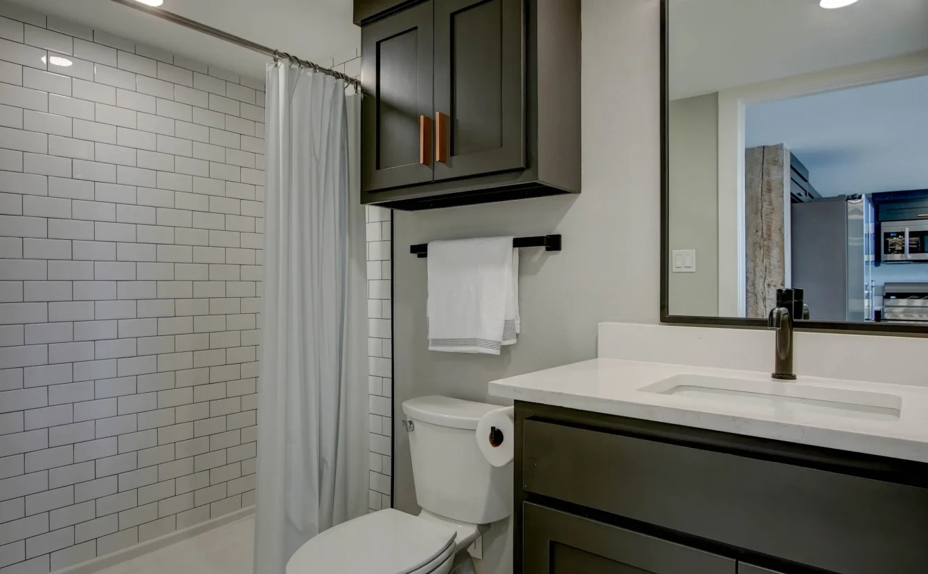 Modern bathroom vanity and toilet in downtown Hot Springs loft rental