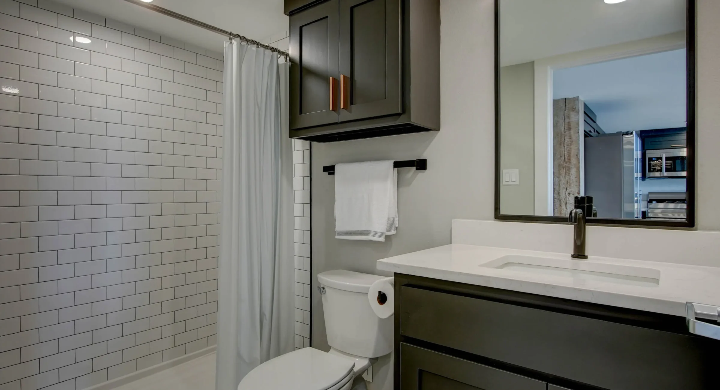 Modern bathroom vanity and toilet in downtown Hot Springs loft rental