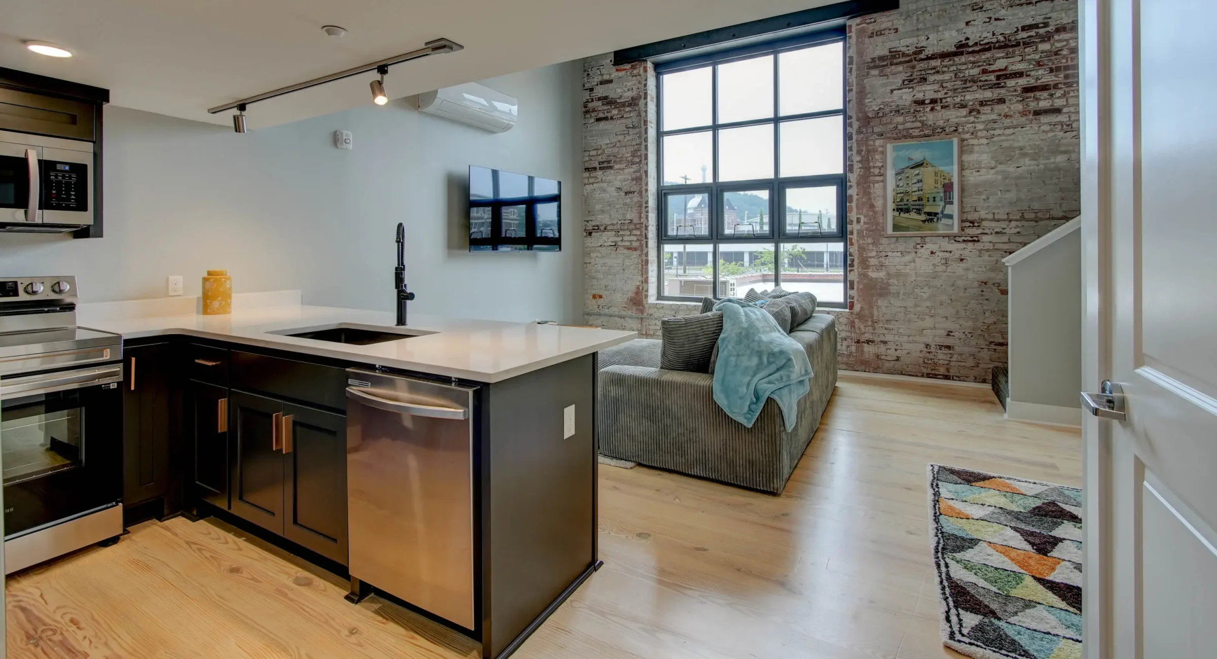 Open-concept loft living space with full kitchen in downtown Hot Springs, Arkansas