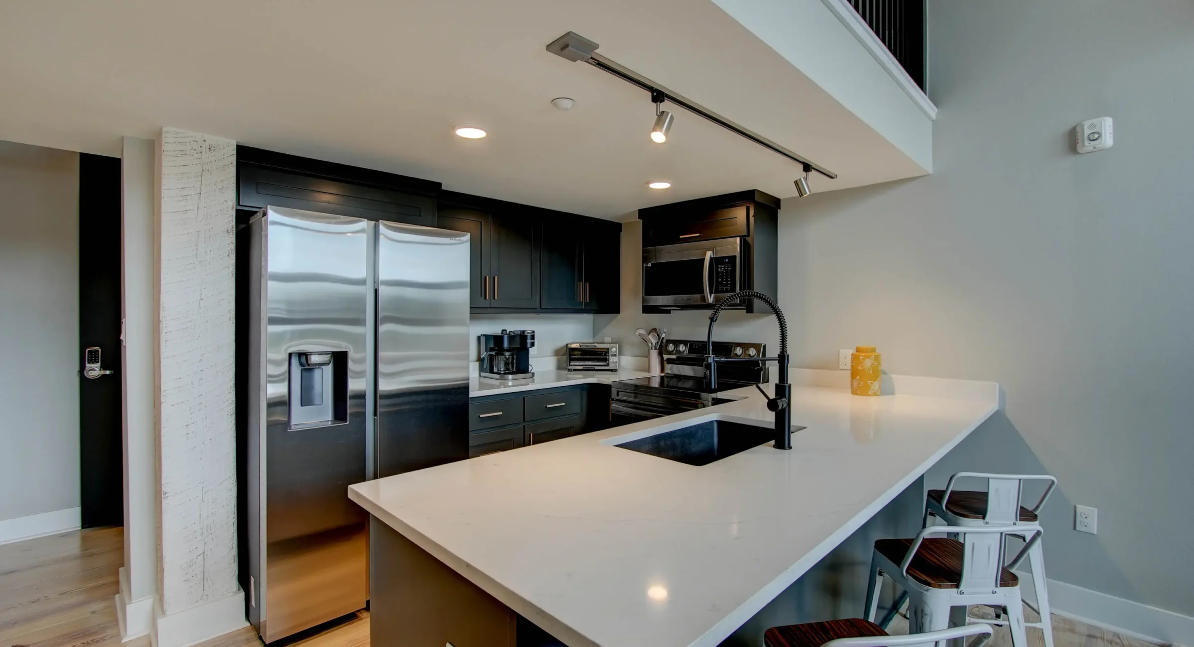 Modern kitchen with breakfast bar in downtown Hot Springs vacation rental