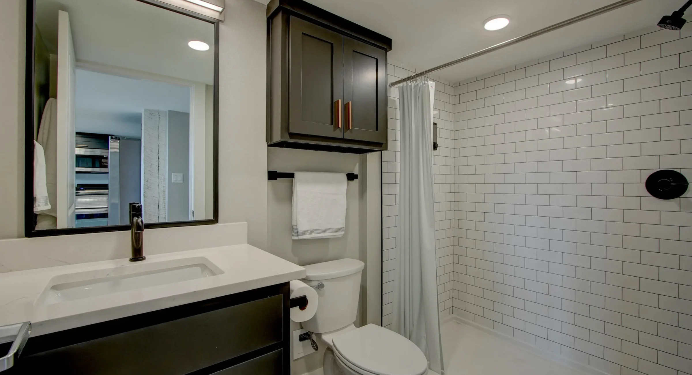 Modern bathroom with walk-in shower in downtown Hot Springs lodging