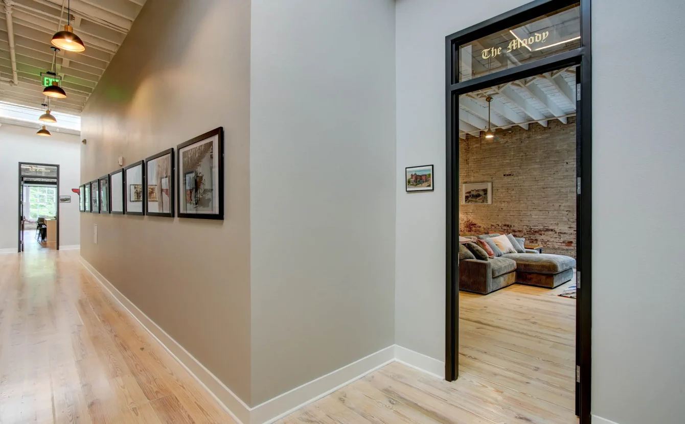 Interior hallway leading to The Moody suite at Lofts at Creek Street