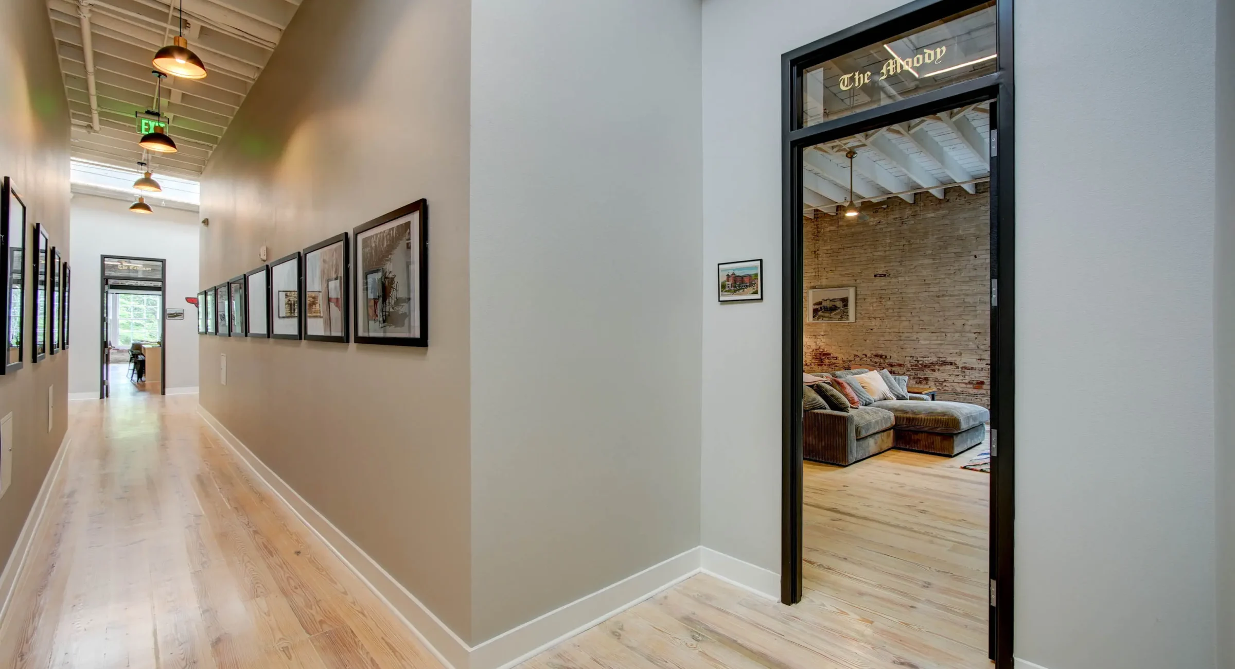Interior hallway leading to The Moody suite at Lofts at Creek Street