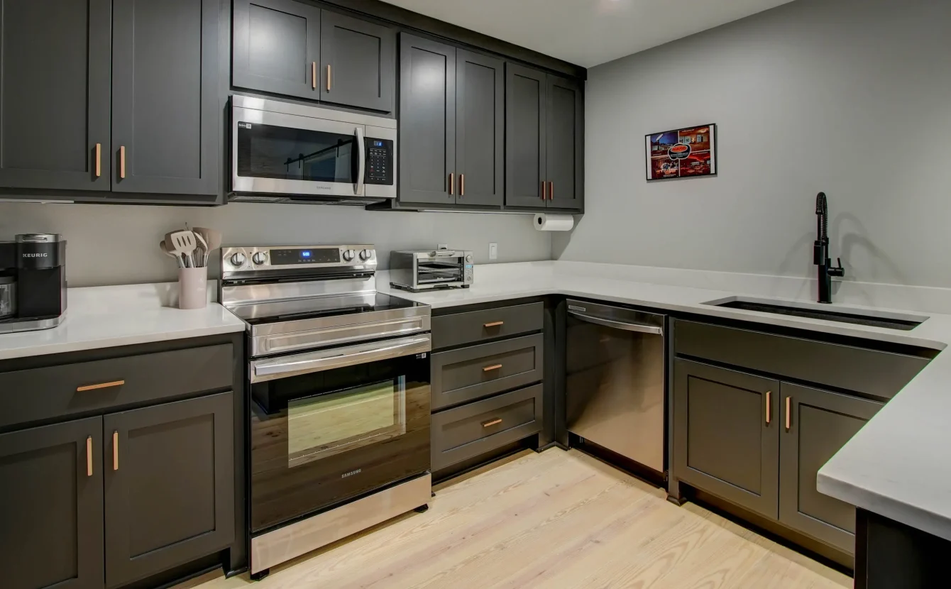 Modern kitchen with stainless appliances in The Moody unit