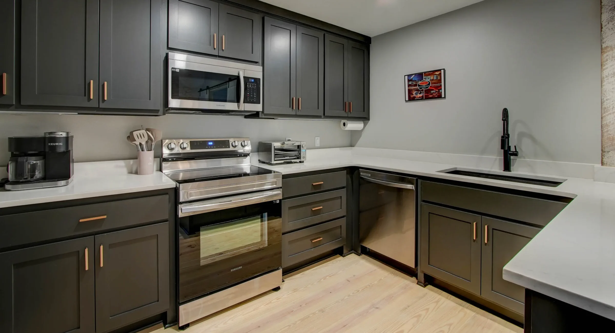Modern kitchen with stainless appliances in The Moody unit
