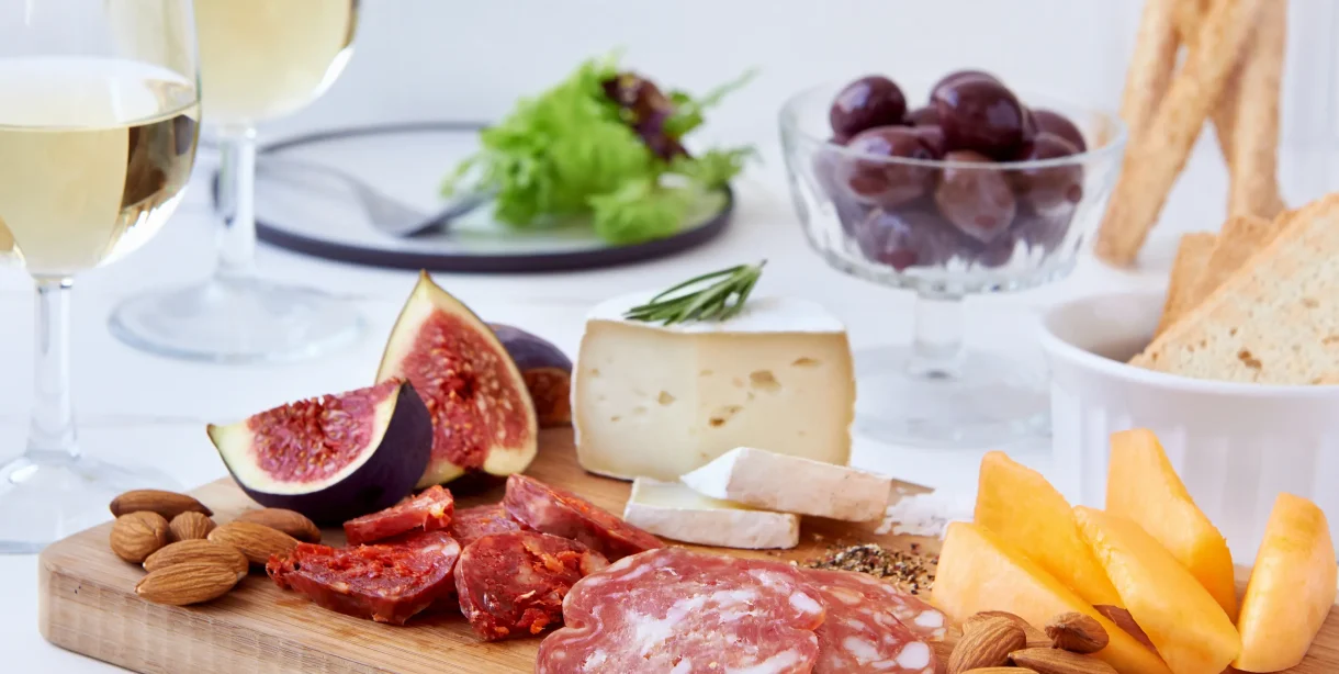 Charcuterie board and champagne for an in-loft dining experience in Hot Springs